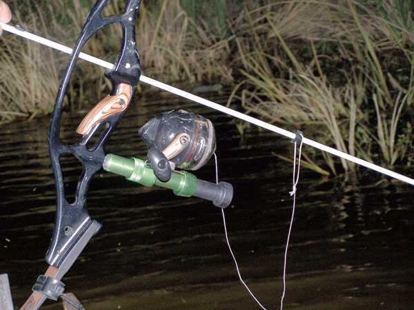 A fishing reel is an integral part of a bowfishing setup. Reels can be hand  wind, bottle reels or spincasters like this one. - Mississippi Sportsman